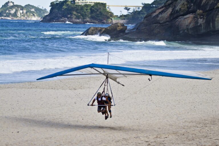 An amazing shot of human trying to fly on a hang glider